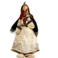 Female Doll Wearing Painted Hide Strap Dress