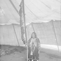 Daughter of Mi-Gisins (Little Eagle) Holding Feather Staff